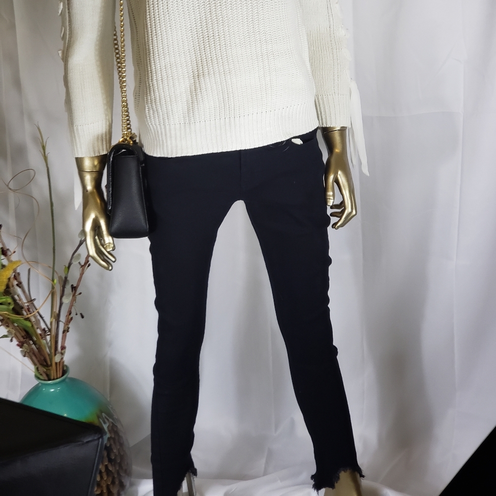 Black jeans with ripped bottom legs